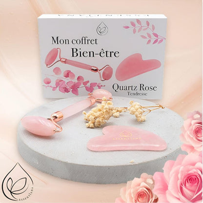 Coffret bien-être Quartz Rose avec rouleau de massage et gua sha à côté de son emballage