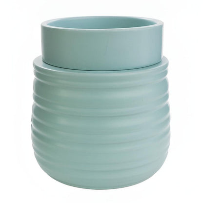 Photographie sur fond blanc de la lampe parfumée électrique turquoise en céramique réactive avec sa coupelle amovible assortie.